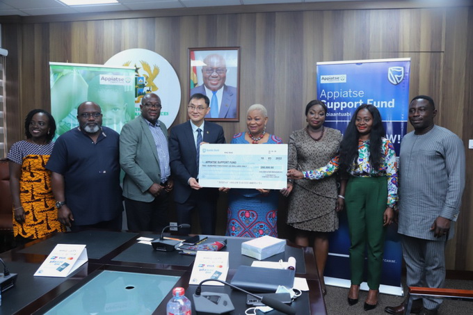 Mr. Chen Zhiyong, Chairman and Executive President of Golden Star and Rev. Joyce Aryee, Chairperson for the Appiatse Support Fund Committee (centre), with other officers of the two bodies at the ceremony.